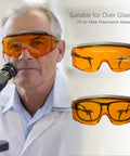 Top Shelf Laser Safety Glasses With Od6 Plus Uv400 Filter For Tattoo And Pmu Removal Techs, clear orange goggles fitting over prescription glasses.