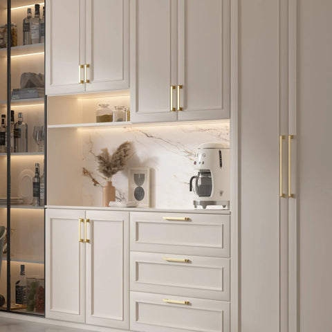 Modern kitchen with 10 Pack 4 Inch Brushed Gold Cabinet Pulls made from solid zinc alloy installed on white cabinets and drawers.