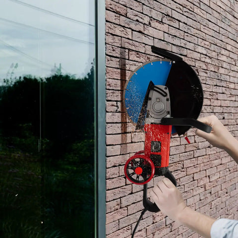 14 Inch Electric Concrete Saw and Wall Grooving Machine with Slick Rolling Base cutting through brick, showing water spray for dust control.