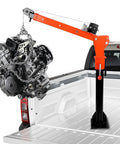 Solid As A Rock Folding Truck Bed Crane With 1100 Lb Capacity And 2000 Lb Electric Winch 12V 360 Swivel Alloy Steel Jib Hoist lifting an engine in a pickup truck bed.