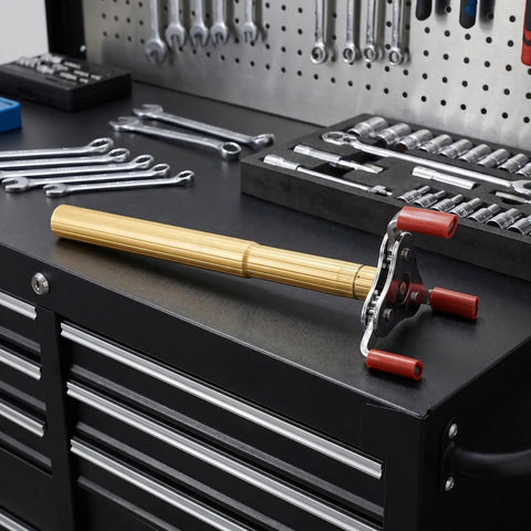 Kick The Ladder Aside With This No Sweat Smoke Detector Removal Tool Featuring A Smooth Aluminum Claw For Quick Ceiling Fire Alarm Takedown And Stress Free Diy Repairs At Home Or Work on workbench with tools.