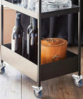 Four Pack Three Inch Gray Pvc Swivel Casters With Lock Brake Stem Mount on black utility cart with wine bottles.