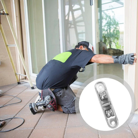 Worker replacing sliding patio door wheels with Slick Gliding Heavy Duty Nylon Roller Wheels With Double Bearings For Sliding Patio Doors And Windows Silent Operation Replacement Pulleys Built Like A Tank And Made To Last.