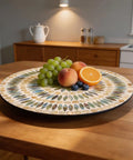 13.4 Inch Round Mother Of Pearl Lazy Susan With Dot Blue Shell Design Hella Smooth Rotating Turntable Tray displaying fruit.
