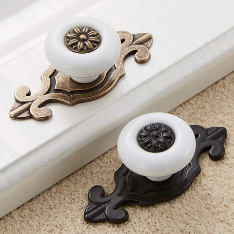 Simple Ceramic Dresser Knobs With Vintage Backplate Drawer Pulls 10 Pack Featuring Slick Zinc Alloy Base For Super Easy Diy Home Refreshes And Flawless Furniture Makeovers. Two ceramic knobs on vintage backplates.