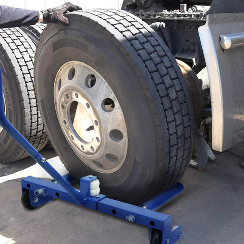 Heavy Duty 500 Lb Tire Dolly Adjustable Roller Cart fits 12 to 24 inch wheels positioned under a truck tire for easy movement.