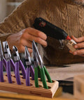 Wood Pliers Block Organizer for the Bench Holds 6 Pairs of Pliers on Workbench with DIY Craft in Background