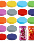 Hella Versatile Wide Mouth Mason Jar Lids 16 Pack Dope Colored Plastic Caps For Ball And Kerr Canning Jars, assorted colors and jars with contents.