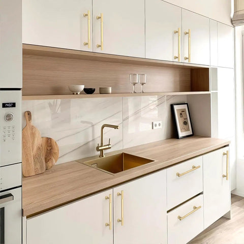 Pro Grade Brushed Gold Cabinet Pulls And Drawer Handles 5 Inch Center To Center kitchen hardware on modern white cabinetry.