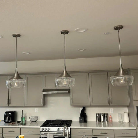 13 Inch Modern Pendant Light With Clear Schoolhouse Glass Shade In Brushed Nickel Finish above kitchen island