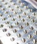 Top Shelf M2.5 Metric Spiral Machine Screw Tap With 0.45 Pitch And Titanium Coating For Slick Threading Tasks Crafted From Tough High Speed Steel That Brings Boss Grade Durability To Every Serious Metalworking Operation, showcasing multiple threaded holes.