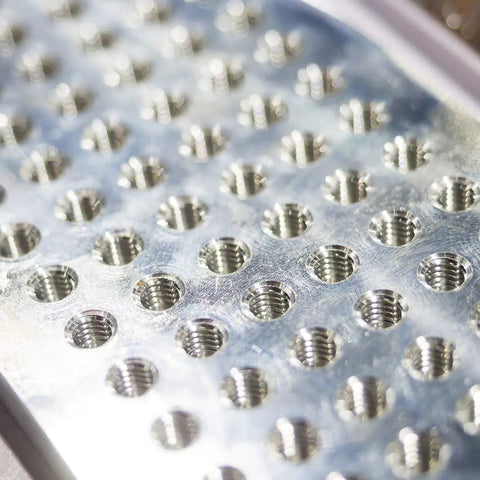 Top Shelf M2.5 Metric Spiral Machine Screw Tap With 0.45 Pitch And Titanium Coating For Slick Threading Tasks Crafted From Tough High Speed Steel That Brings Boss Grade Durability To Every Serious Metalworking Operation, showcasing multiple threaded holes.