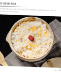 Premium Handcrafted Wood Steamed Rice Bucket With Lid, Round Beige Cask filled with rice and corn, atop a gray cloth.