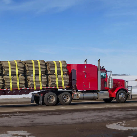 A red truck with a flatbed secured by Beefy Heavy Duty Tie Down Straps 4 In By 30 Ft With Flat Hooks 18,000 Lbs Break Strength WLL 6,000 Lbs 10 Pack