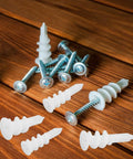 Heavy Duty Drywall Anchors Kit, 300-Piece Plastic Anchors With Spiral Expansion Tubes on wooden surface