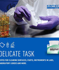 Kimtech Kimwipes Delicate Task Wipes pop-up box, white, 286 sheets; lab scene with purple-gloved hands and test tubes.