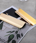 Six Inch Dark Gold Finger Pulls For Kitchen Cabinets And Drawers Aluminum Alloy handles displayed on a magazine.
