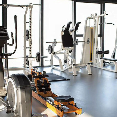 Rock Solid Replacement Glide Rollers Set Of Four For Cross Trainer Equipment With Fully Sealed Bearings and Smooth As Butter Gliding Fits Nearly Every Major Home Gym Model in a fully equipped gym.
