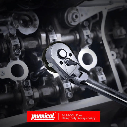 Ratchet wrench being used on an engine part, showcasing Mumicol's tool in action.
