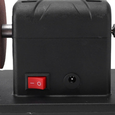 Close-up of Cordless Mini Bench Grinder 3 Inch With Variable Speed 2000 To 6000 RPM power switch and grinding wheel.