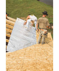 Workers installing Bubble Pack Insulation Roll 24 Inch By 50 Foot With Double Reflective Barrier for thermal control on roof