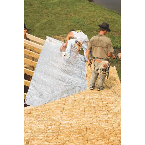 Workers installing Bubble Pack Insulation Roll 24 Inch By 50 Foot With Double Reflective Barrier for thermal control on roof