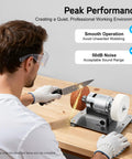 User sharpening a knife with a Rugged Small Bench Grinder With A Badass 96W All Copper Motor For Quick Sharpening And Metal Polishing 6000 RPM High Velocity Benchtop Sander.