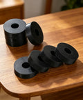 Heavy Duty Rubber Isolation Mounts And Anti Vibration Pads Built Mean To Crush Appliance Rattle With Grippy Wear Base and Quick No Tools Setup For Steady Everyday Machinery on a wooden table.