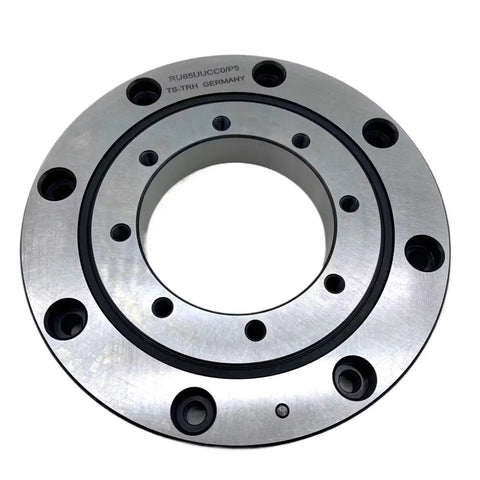 Top Shelf Heavy Duty Cross Roller Slewing Bearing RU85UUCC0 Rotary Ring close-up with silver material and circular design for robot arm joints.