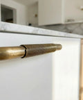 Solid Brass Cabinet Handle With Coiled Wire Grip, Vintage Industrial Style, Antique Brass Finish installed on a kitchen drawer