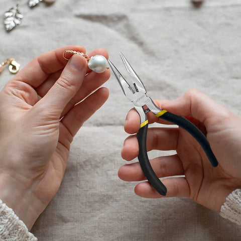 5 Pack Mini Precision Needle Nose Pliers Set With Wire Cutter, Spring Loaded held in hand with jewelry making.