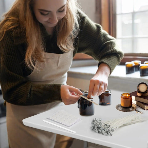 Woman using Candle Making Starter Kit With 130 Pieces Wicks And Full Tool Set For DIY Soy And Beeswax Candles on table