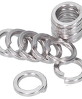 Heavy Duty Spring Split Lock Washer Set 150 Pcs DIN 7980 M6 For Home DIY And Industrial Use Durable Surface Treated Washers Prevent Loosening On Screws And Bolts In Factories And Projects. Stainless steel M6 spring split lock washers stacked and spread on white background