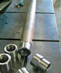 3/4 Inch Chromoly Heim Joint Kit Beasts Mode 3/4 By 16 Threads with rod end and weld bungs on a workbench.