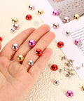 Hand holding Stylish Lightweight Plastic Dome Studs For DIY Leather Jacket Sewing Featuring Kickass Flat Back Rivet Hardware With Secure Alignment Nails To Upgrade Fashion Items In Dope Purple, including various colors.