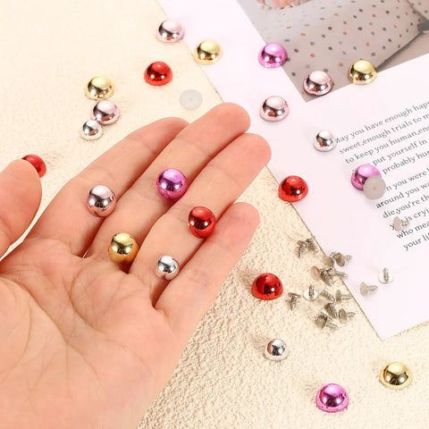 Hand holding Stylish Lightweight Plastic Dome Studs For DIY Leather Jacket Sewing Featuring Kickass Flat Back Rivet Hardware With Secure Alignment Nails To Upgrade Fashion Items In Dope Purple, including various colors.