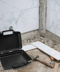 Top Shelf All Weather Badass Black Plastic Toolbox With Removable Storage Tray Portable Repair Case For Small Parts Organizing And Hand Tool Carrying Boss Grade Equipment Box on a construction site.