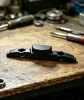Luggage Repair Button And Replacement Pull Handle Fix Broken Suitcase Grips With Ease Solid Black Plastic on workbench.