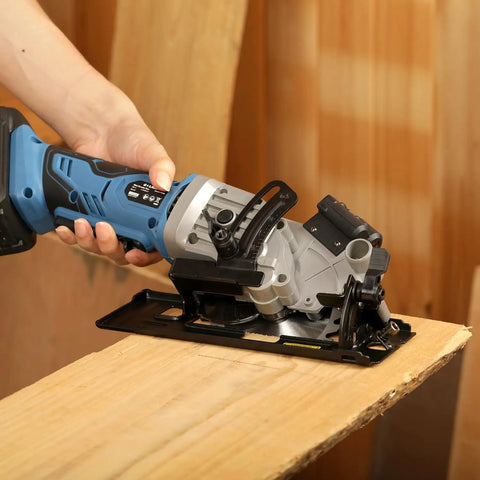 Badass Cordless Mini Circular Saw Featuring 4-1/2-Inch Pure Copper Motor and Integrated Laser Guide for Clean Cuts in use on wood.