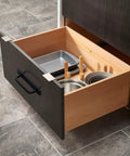 Open drawer with matte black cabinet pull handle installed, showing 12 Pack Matte Black Cabinet Pull Handles With Base Plate Aluminum Alloy