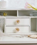 Premium Zinc Alloy Cabinet Knobs 4 Pack Featuring Floral Rhinestone Inlays on white dresser drawers with decorative items.