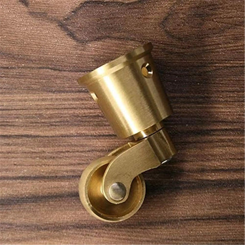 Built Tough Heavy Duty Antique Casters Featuring Sweet Smooth Gliding Solid Brass Wheels And Rock Solid Double Bearings For Easy Furniture Rolling And Zero Floor Scratches, shown from the side on wooden surface.