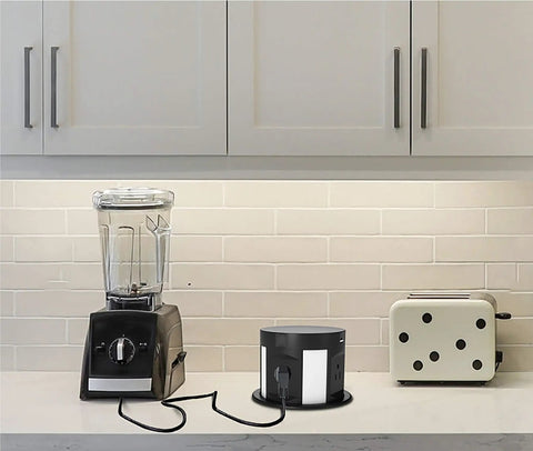 Automatic Pop Up Outlet For Countertops With Recessed Power Strip 4 AC Outlets 2 USB A 2 USB C And Wireless Charging Station on kitchen counter