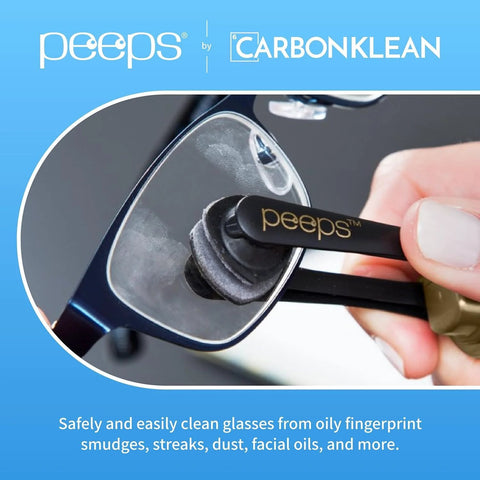 Peeps eyeglass lens cleaner by CarbonKlean, black microfiber pad cleaning a glasses lens (close-up)