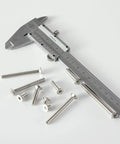 Heavy Duty M5 Flat Head Hex Socket Countersunk Screws Assorted Lengths Twenty To Forty Millimeters next to a caliper for measurement.