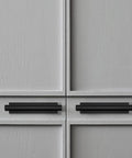 Close-up of 15 Pack Self Stick Push Pull Cabinet Handles Black ABS Plastic Installed on Cabinet Doors