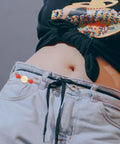 12 Piece Heavy Duty Alloy Waist Adjustment Pins To Fix Baggy Jeans And Bulkier Sweaters Metal Safety Brooch Clips on denim jeans.