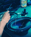Detail of hand working on Rugged Heavy Duty Rubber Vibration Dampening Washers Round Shock Absorbing Feet Pads 3 Inch Od.