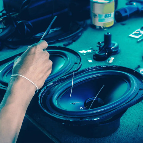 Detail of hand working on Rugged Heavy Duty Rubber Vibration Dampening Washers Round Shock Absorbing Feet Pads 3 Inch Od.