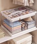 24 Quart Clear Plastic Storage Bins 2 Pack Double Layer Craft Organizer With Divided Sections For Sewing Supplies Keepin Your Hobby Corner Super Tidy Zero Grind Game Changer Setup filled with neatly rolled clothes and accessories.